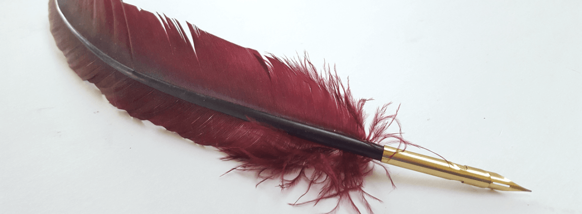 a feather pen (quill)